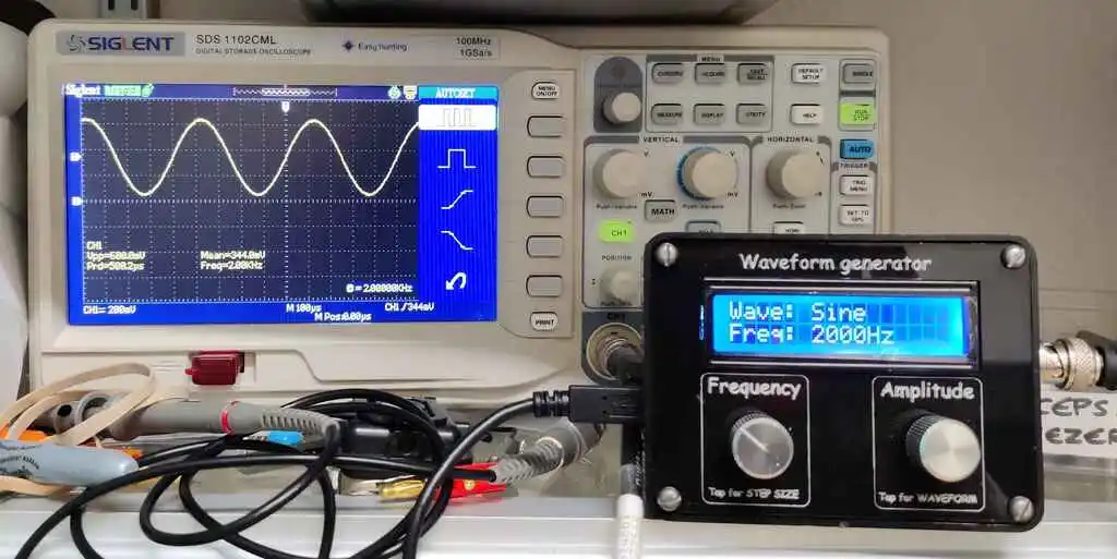 picture of oscilloscope showing trace from waveform generator